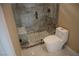 Modern bathroom featuring stylish glass enclosed shower and ceramic tile flooring at 197 E Shelbourne Ave, Las Vegas, NV 89123