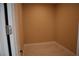 Image of walk-in closet showing white marbled ceramic tile flooring at 197 E Shelbourne Ave, Las Vegas, NV 89123