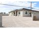 Single-story home with desert landscaping, modern windows and gray exterior at 197 E Shelbourne Ave, Las Vegas, NV 89123