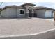 Charming single-story home featuring a gray exterior, gated entry and desert landscaping at 197 E Shelbourne Ave, Las Vegas, NV 89123
