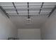 View of garage ceiling with modern lighting and door mechanism, offering convenience and functionality at 197 E Shelbourne Ave, Las Vegas, NV 89123
