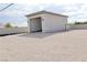 Spacious detached garage with open door and room for multiple vehicles, offering secure parking and extra storage at 197 E Shelbourne Ave, Las Vegas, NV 89123