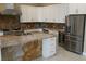 Modern kitchen features stone countertops, stainless steel appliances, and custom white cabinets at 197 E Shelbourne Ave, Las Vegas, NV 89123