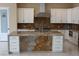Modern kitchen features a large island, stainless steel appliances, custom cabinets, and elegant countertops at 197 E Shelbourne Ave, Las Vegas, NV 89123