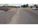 Wide street view with an undeveloped lot ready for new construction on a clear, sunny day at 197 E Shelbourne Ave, Las Vegas, NV 89123