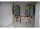 Utility room with tankless water heaters at 197 E Shelbourne Ave, Las Vegas, NV 89123