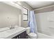 Bathroom features modern vanity and shower-tub combo with curtain at 2062 Club Crest Way, Henderson, NV 89014