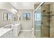 Updated bathroom with a glass-enclosed shower and dual sink vanity at 2062 Club Crest Way, Henderson, NV 89014