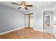 Bedroom with hardwood floors, mirrored closet, and ceiling fan at 2062 Club Crest Way, Henderson, NV 89014