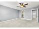 Bedroom with ceiling fan, carpet, ensuite bathroom, and closet at 2062 Club Crest Way, Henderson, NV 89014