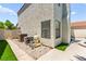 Exterior home features include a well maintained stucco wall, gravel and artificial turf at 2062 Club Crest Way, Henderson, NV 89014