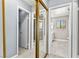 Hallway with closet door and open view into a bathroom at 2062 Club Crest Way, Henderson, NV 89014