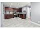 Spacious kitchen features stainless steel appliances, dark cabinetry and a tile backsplash at 2062 Club Crest Way, Henderson, NV 89014