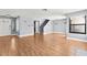Expansive living area with wood floors, staircase, and plenty of natural light at 2062 Club Crest Way, Henderson, NV 89014