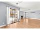 Open living room featuring a fireplace, wood floors, and sliding glass doors to pool at 2062 Club Crest Way, Henderson, NV 89014