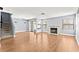 Open-concept living space with wood floors, fireplace, and abundant natural light at 2062 Club Crest Way, Henderson, NV 89014