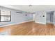 Large living room with modern lighting fixtures, wood floors, and neutral paint colors at 2062 Club Crest Way, Henderson, NV 89014