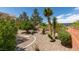 Beautiful backyard featuring stone landscaping, desert plants and gravel throughout at 2120 Desert Woods Dr, Henderson, NV 89012
