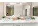 Bright bathroom features a double sink vanity with modern fixtures and rectangular mirrors at 2227 Garden City Ave, Henderson, NV 89052