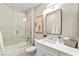Elegant bathroom boasts a glass-enclosed shower with marble-like tiles and modern fixtures at 2227 Garden City Ave, Henderson, NV 89052