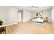 Bright bedroom with neutral walls, wood floors, a ceiling fan, and large windows for natural light at 2227 Garden City Ave, Henderson, NV 89052