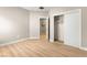 Bright bedroom boasts minimalist design, laminate flooring, and closet for storage at 2227 Garden City Ave, Henderson, NV 89052