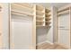 Bright walk-in closet boasts custom shelving and closet rods for optimal organization at 2227 Garden City Ave, Henderson, NV 89052