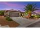 Charming single-story home with a two-car garage and mature palm tree at 2227 Garden City Ave, Henderson, NV 89052