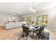 Open-concept living space with dining area, living room, and access to outdoor space at 2227 Garden City Ave, Henderson, NV 89052