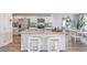 Bright kitchen features stainless steel appliances, a large island with bar seating, and ample cabinet space at 2630 Begonia Falls Ave # 37, North Las Vegas, NV 89081