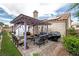 Cozy backyard oasis featuring an inviting pergola and ample space for outdoor dining and entertaining at 3157 Capetown Way, Las Vegas, NV 89128