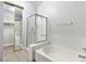 The bathroom features a tiled shower with glass door, along with a large soaking tub and modern fixtures at 3157 Capetown Way, Las Vegas, NV 89128