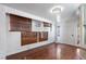 Bonus room with wood-look flooring, natural light, and backyard access at 3157 Capetown Way, Las Vegas, NV 89128