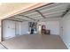 Spacious two-car garage offering ample storage and potential workspace with updated garage door and clean floors at 3157 Capetown Way, Las Vegas, NV 89128