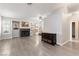 Open living room with a fireplace, sliding glass doors to the backyard, and neutral colors at 3157 Capetown Way, Las Vegas, NV 89128