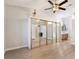 This main bedroom features a ceiling fan, spacious closet with mirrored doors, and adjacent bathroom with modern fixtures at 3157 Capetown Way, Las Vegas, NV 89128