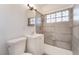 Updated bathroom featuring a shower/tub combo, sleek vanity, and modern fixtures at 3200 E Owens Ave, North Las Vegas, NV 89030