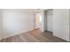 Bright bedroom featuring new wood-look flooring and a closet with an open door at 3200 E Owens Ave, North Las Vegas, NV 89030