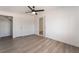 This bedroom features modern ceiling fan, light wood floors, and closet at 3200 E Owens Ave, North Las Vegas, NV 89030