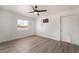 Bright bedroom features modern ceiling fan, light wood floors, and plenty of natural light at 3200 E Owens Ave, North Las Vegas, NV 89030
