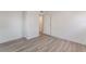 Bedroom features light wood floors, white trim, and closet at 3200 E Owens Ave, North Las Vegas, NV 89030