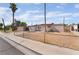 Cozy single-story home with a fenced front yard and sparse landscaping at 3200 E Owens Ave, North Las Vegas, NV 89030