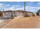 Charming single-story home with a fenced front yard and desert landscaping at 3200 E Owens Ave, North Las Vegas, NV 89030