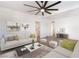 Bright living room showcasing a modern ceiling fan, and stylish furnishings at 3200 E Owens Ave, North Las Vegas, NV 89030