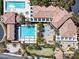 Overhead view of a community pool, spa, putting green, seating, and well-maintained landscapes at 3205 Rainmaker St, Las Vegas, NV 89129