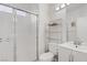 This bathroom offers a stand-up shower with a glass enclosure and white vanity at 3205 Rainmaker St, Las Vegas, NV 89129
