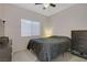 Bedroom featuring a ceiling fan, a queen bed, and a closet at 3205 Rainmaker St, Las Vegas, NV 89129