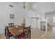 Inviting dining area with a high ceiling, with staircase view, ideal for entertaining guests at 3205 Rainmaker St, Las Vegas, NV 89129