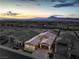 Scenic aerial view of home at sunset, showcasing neighborhood and mountain views at 326 Beethoven Ridge Dr, Henderson, NV 89011