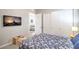 Spacious bedroom with white closet doors and a flat screen television at 326 Beethoven Ridge Dr, Henderson, NV 89011